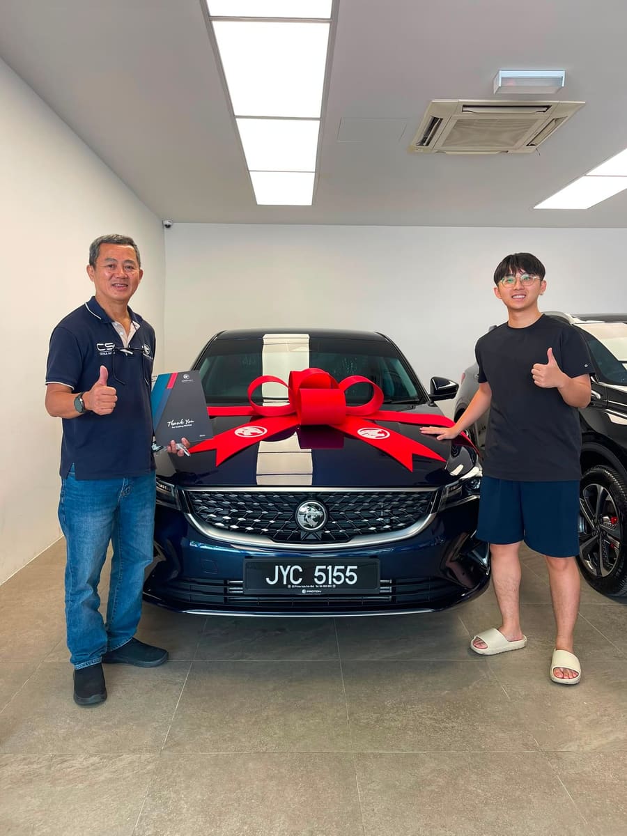 A customer collecting their new Proton